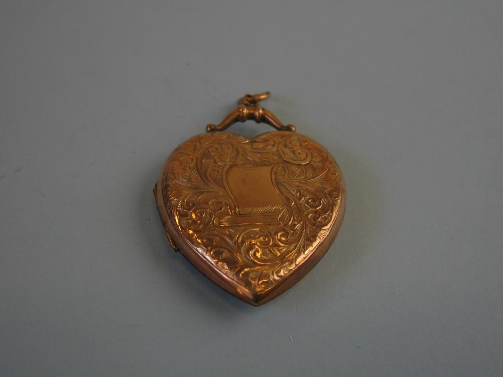 Appraisal: A Victorian heart shaped Locket with scroll engraving and vacant