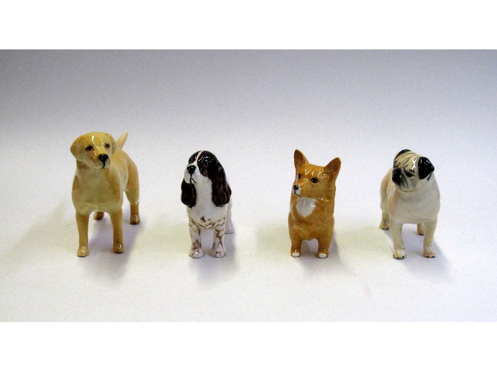 Appraisal: Four Beswick figures of dogs to include Labrador Pug Spaniel