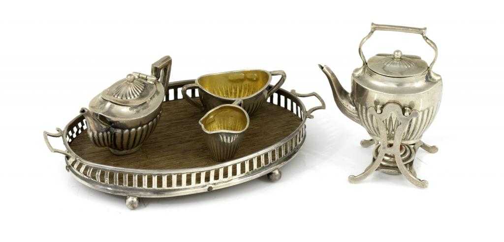 Appraisal: AN ENGLISH SILVER TOY TEA SERVICE including an oval gallery