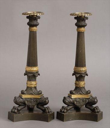 Appraisal: PAIR OF EMPIRE-STYLE GILT-METAL MOUNTED BRONZE CANDLESTICKS Each reeded stem