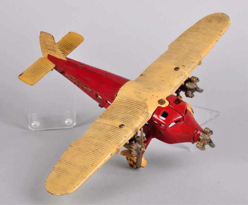 Appraisal: Cast Iron Kilgore Tri-Motor Tat Airplane Toy Description American Larger