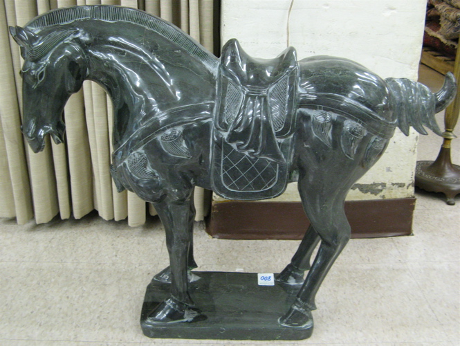 Appraisal: CHINESE BLACK MARBLE SCULPTURE the standing figure of a Tang