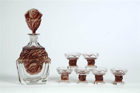 Appraisal: CZECHOSLOVAKIAN WINE SET Clear glass paneled set with impressed frosted