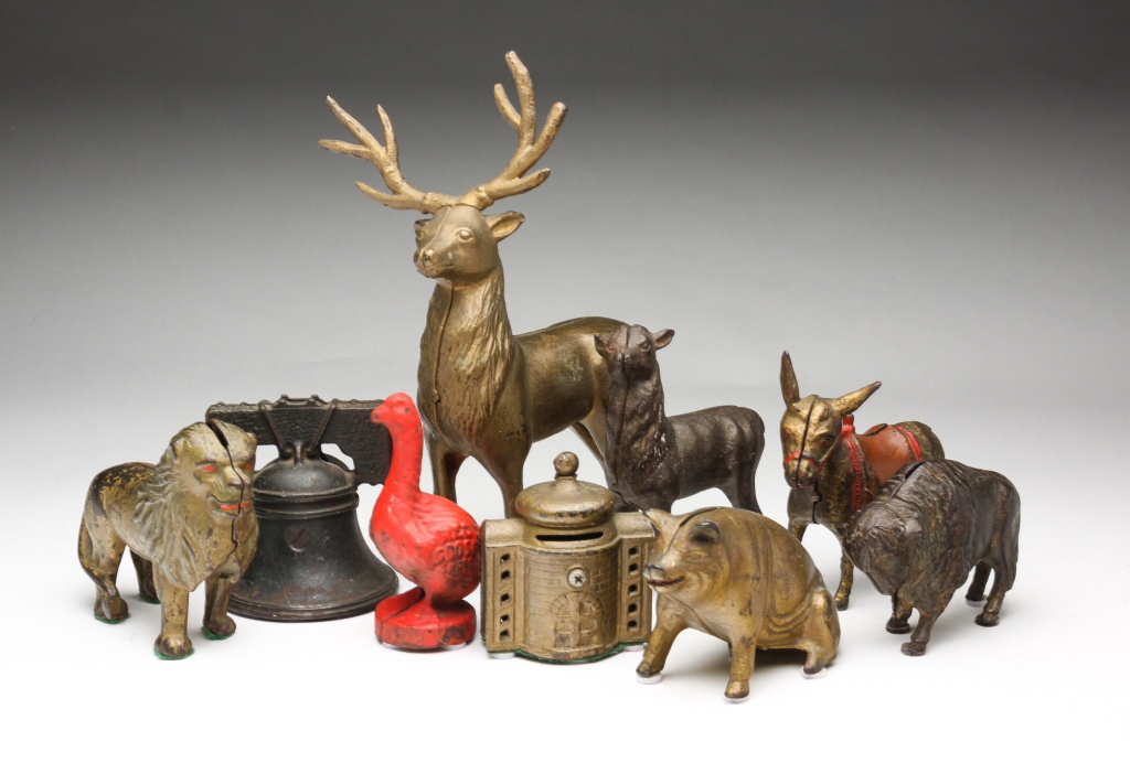 Appraisal: NINE AMERICAN CAST IRON BANKS Circa Including a pig red