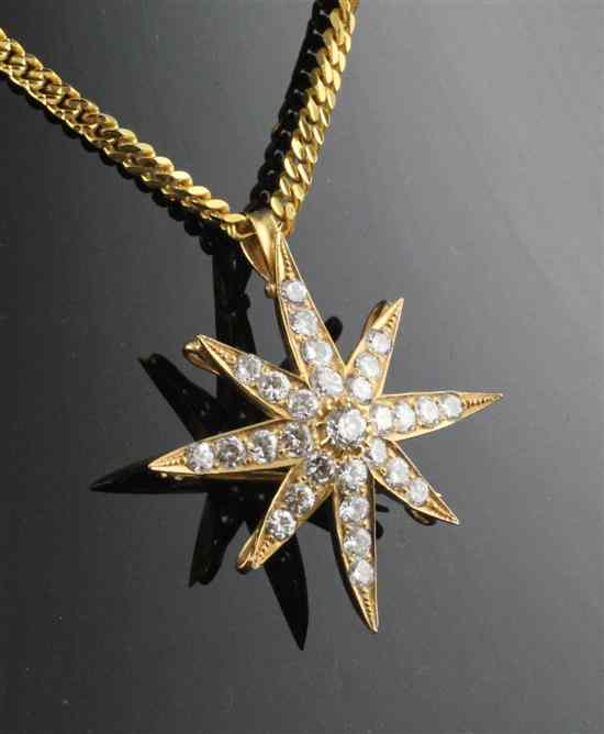 Appraisal: A ct gold and diamond starburst pendant with brooch fitting