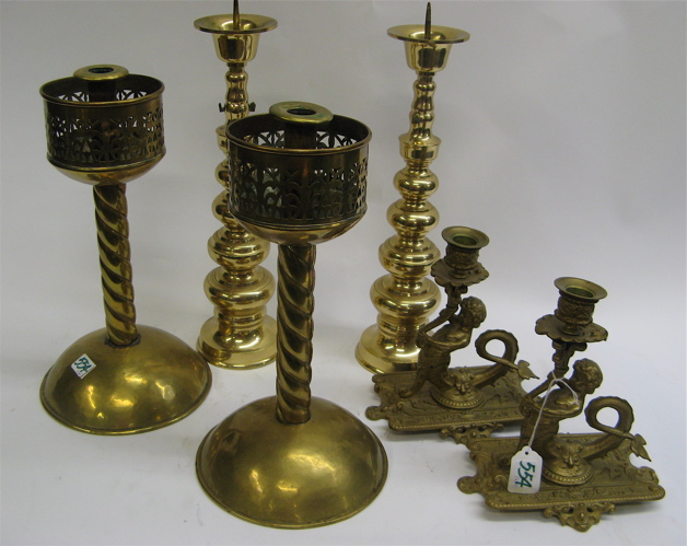 Appraisal: THREE PAIR OF BRASS PLATED CANDLESTICKS including stylized putti on