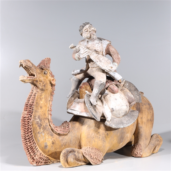 Appraisal: Large Chinese ceramic camel and rider statue with intricately molded