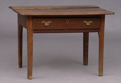 Appraisal: GEORGE III ELMWOOD SINGLE-DRAWER SIDE TABLE The molded overhang top