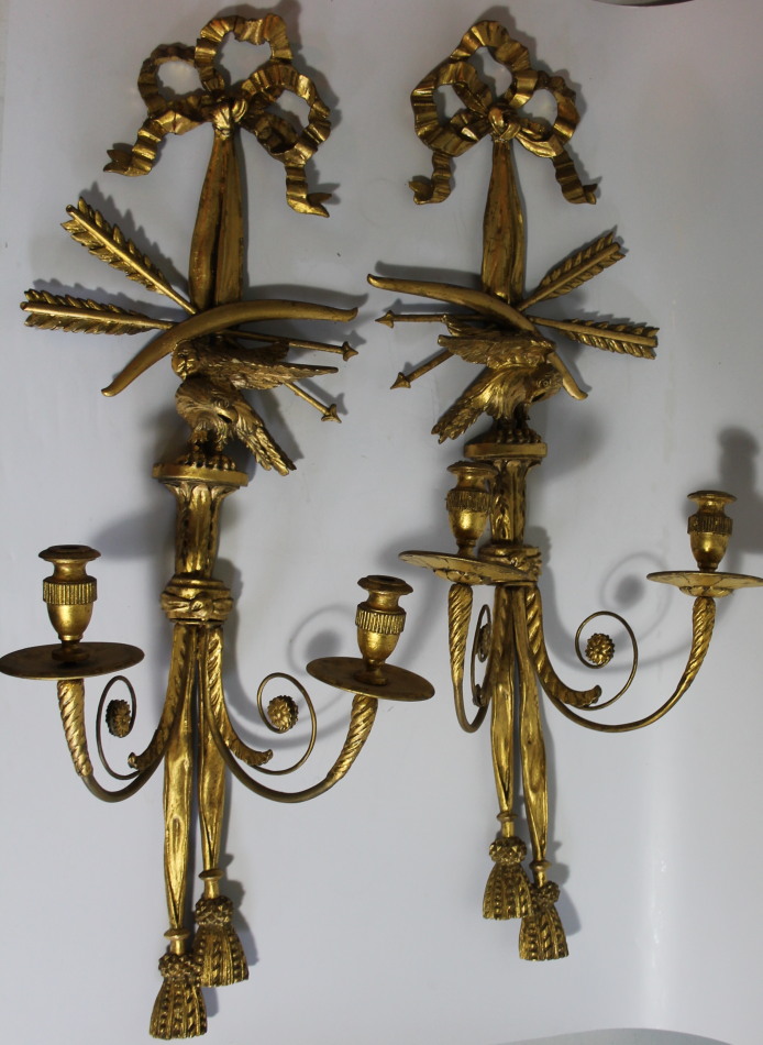 Appraisal: A pair of early thC giltwood and gesso wall lights