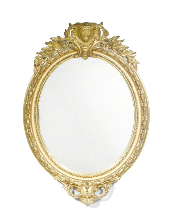 Appraisal: AN OVAL MIRROR Napoleon III Gilded wood and stucco H