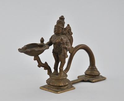 Appraisal: An Indian Patinated Figural Oil Lamp In the form of