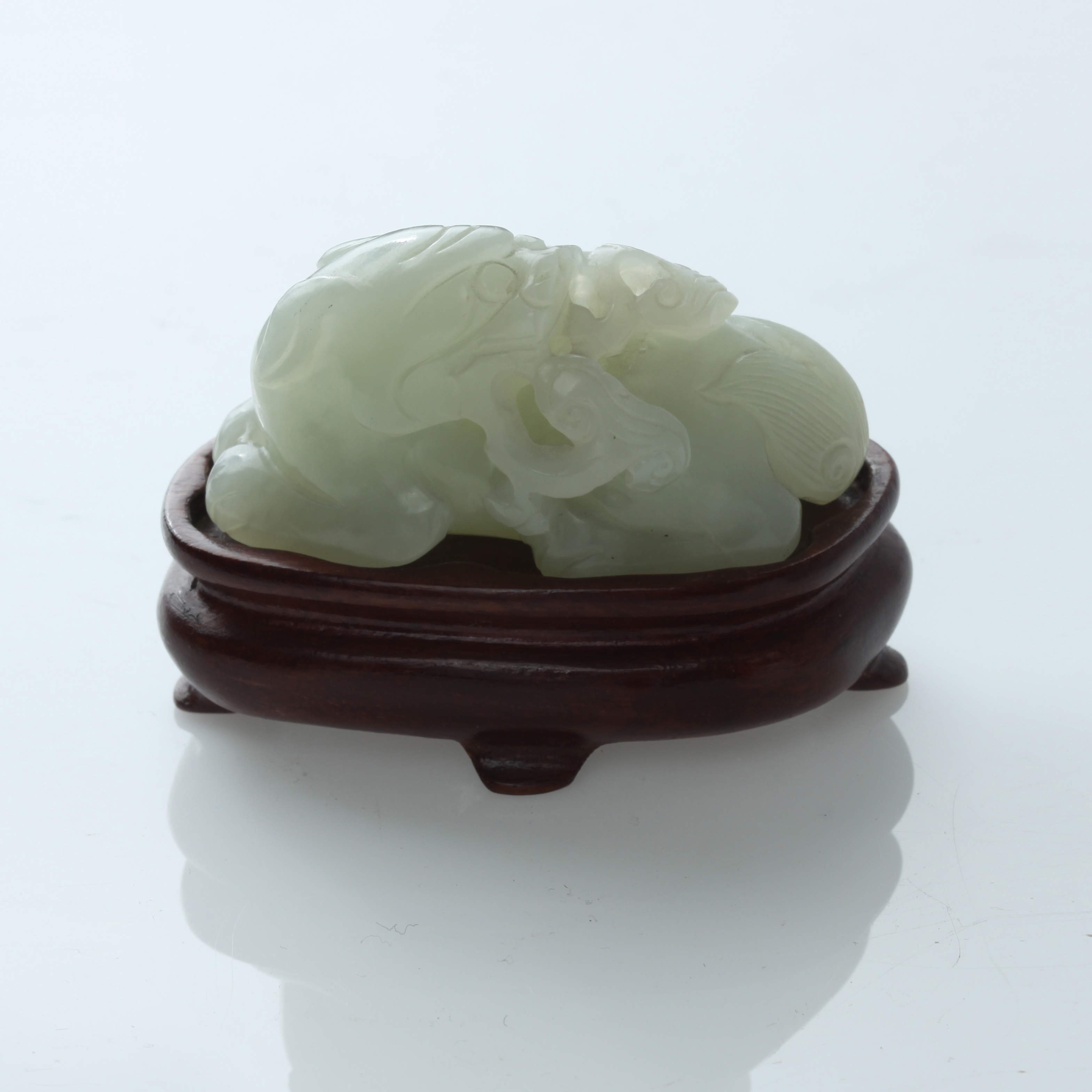 Appraisal: CHINESE NEPHRITE JADE CARVING OF AN AUSPICIOUS ANIMAL TH TH