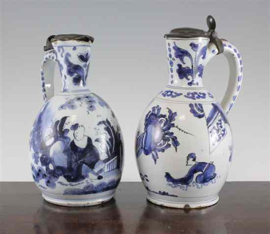 Appraisal: Two Delft blue and white jugs c - each with