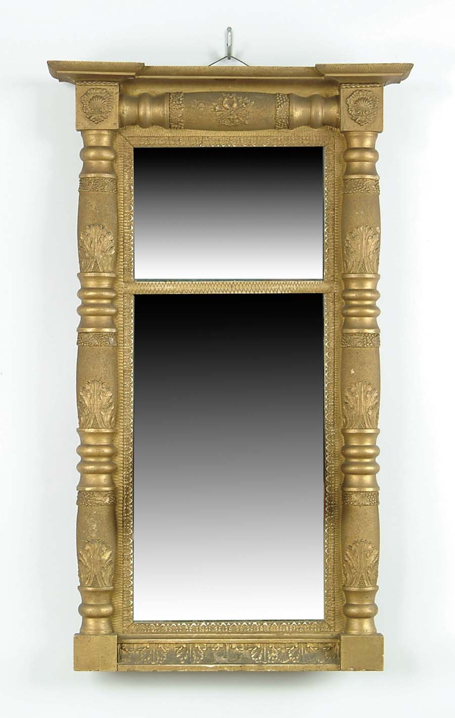 Appraisal: SPLIT COLUMN EMPIRE TWO PART MIRROR Shaped cornice having gesso