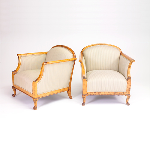 Appraisal: Pair of Biedermeier club chairs with carved wood frames cabriole