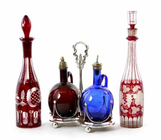 Appraisal: Cut-clear decanters and cruet with decanters near pair of Bohemian