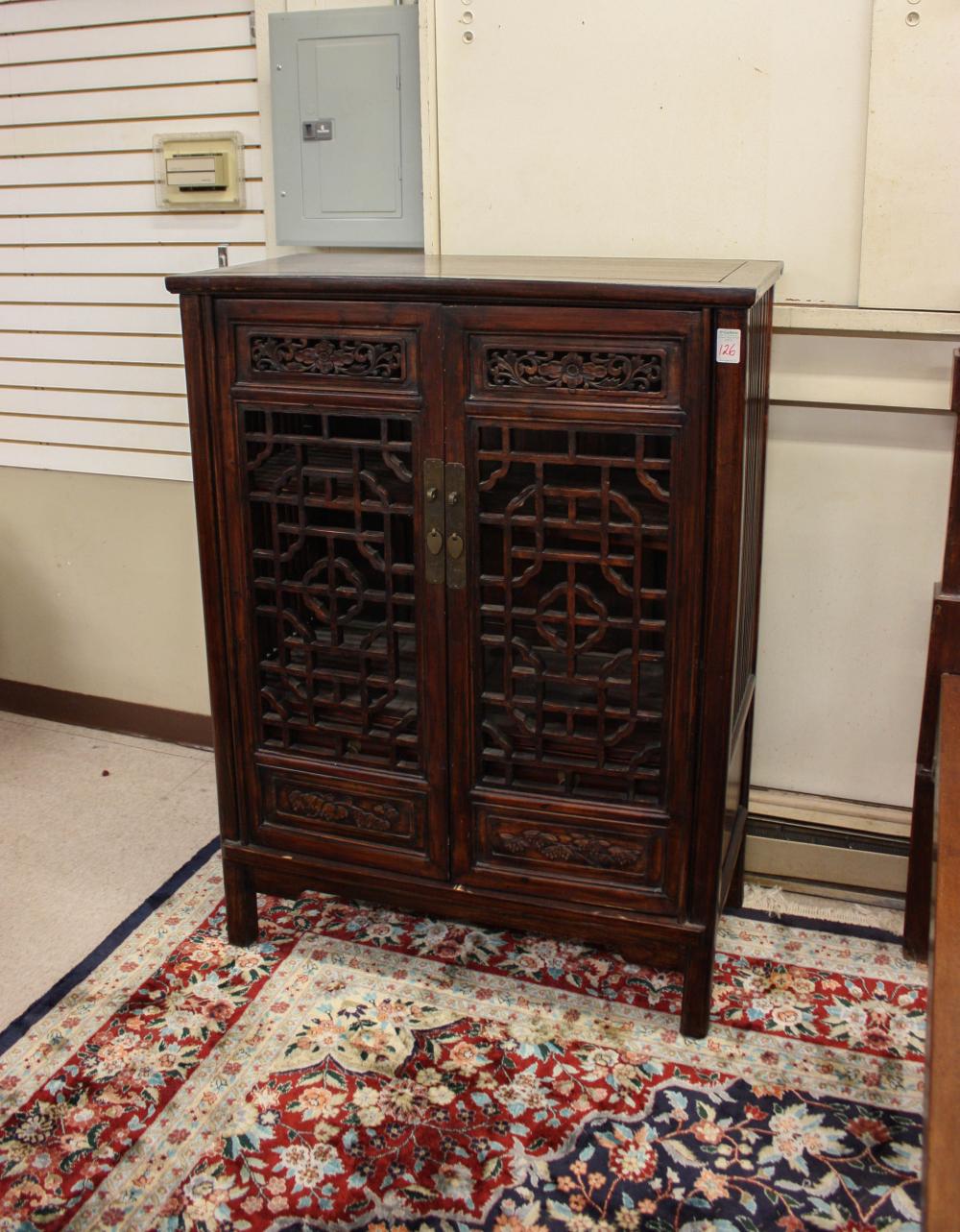 Appraisal: CHINESE MING-STYLE FRETWORK CABINET having three interior drawers and shelf