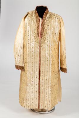 Appraisal: An Indian cream silk coat with gold and claret embroidery