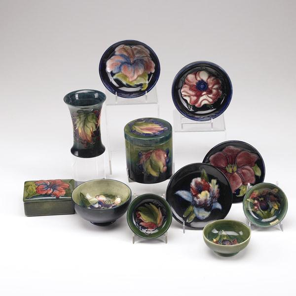 Appraisal: MOORCROFT Eleven pieces in assorted floral patterns two covered boxes