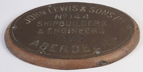 Appraisal: An oval brass plaque for 'John Lewis Sons Ltd No