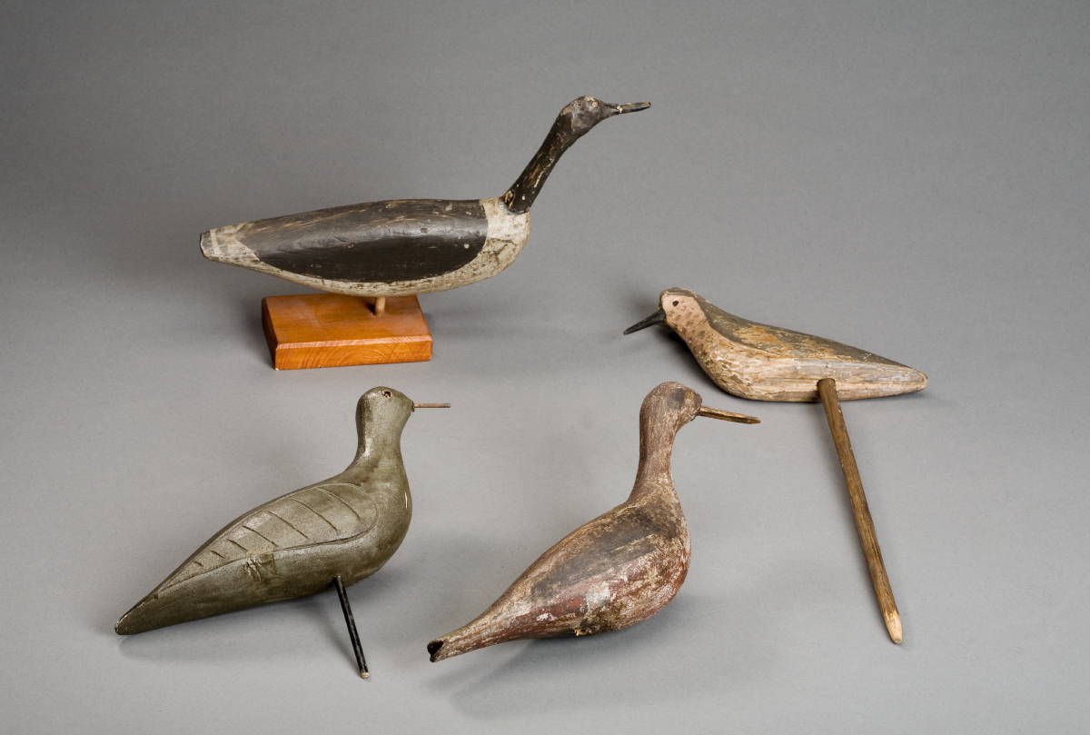 Appraisal: FOUR CARVED AND PAINTED SHOREBIRD DECOYS Length of largest inches