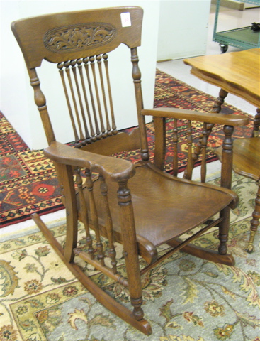 Appraisal: LATE VICTORIAN OAK ROCKING ARMCHAIR American late th century with