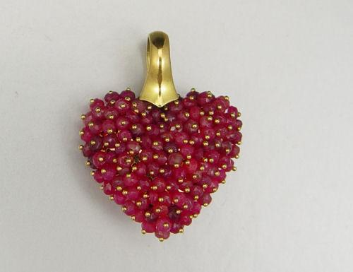 Appraisal: K RED SAPPHIRE HEART PENDANT K yellow gold puffed heart