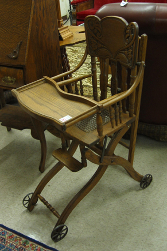 Appraisal: LATE VICTORIAN OAK PRESSED-BACK INFANT HIGHCHAIR STROLLER American c -