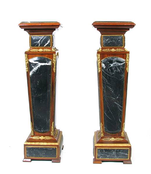 Appraisal: A pair of Regence style bronze mounted mahogany pedestals with