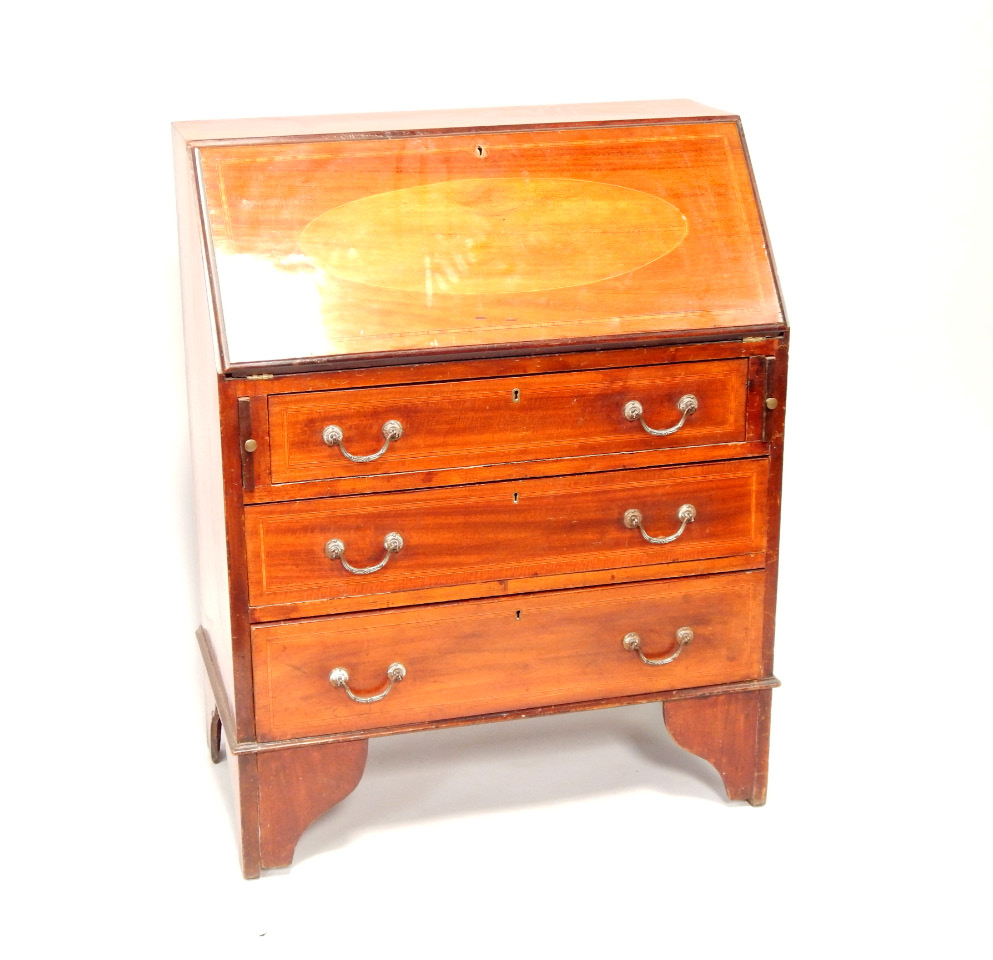 Appraisal: An Edwardian mahogany bureau having crossbanded and inlaid slope above