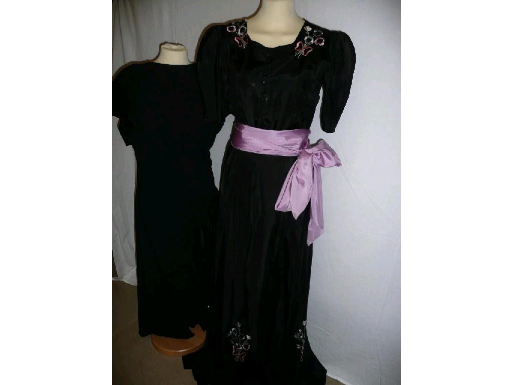 Appraisal: A 's black evening dress with embroidered bunches of flowers