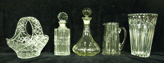 Appraisal: A silver long cut glass mounted decanter together with another