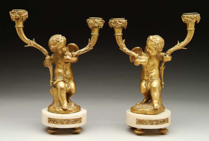 Appraisal: PAIR OF CHERUB DECORATED BRONZE AND ALABASTER CANDELABRAS h cherubs