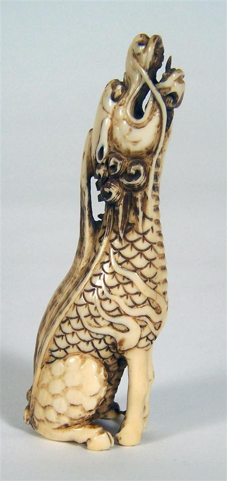 Appraisal: A Japanese stained ivory okimone Meiji period in the form