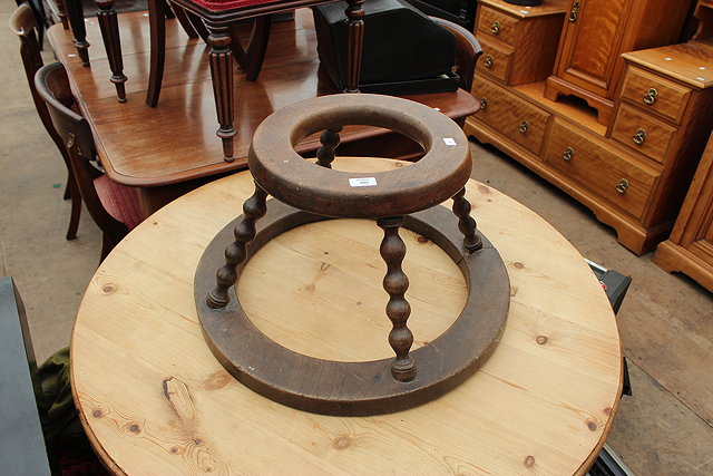 Appraisal: A VCITORIAN MAHOGANY BABY WALKER of circular form with bobbin