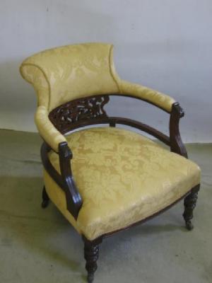 Appraisal: A VICTORIAN WALNUT SALON CHAIR of tub form upholstered in