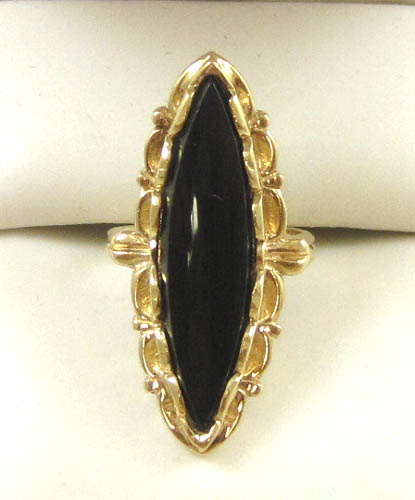 Appraisal: BLACK ONYX AND FOURTEEN KARAT GOLD RING set with a