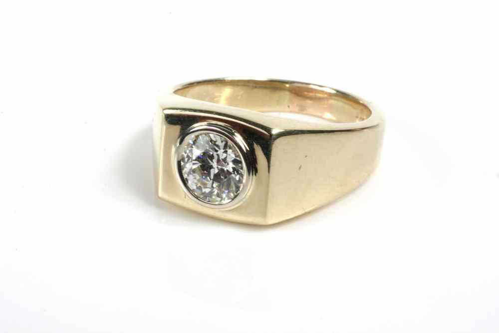 Appraisal: GENT'S RING - One K yellow gold contemporary design ring