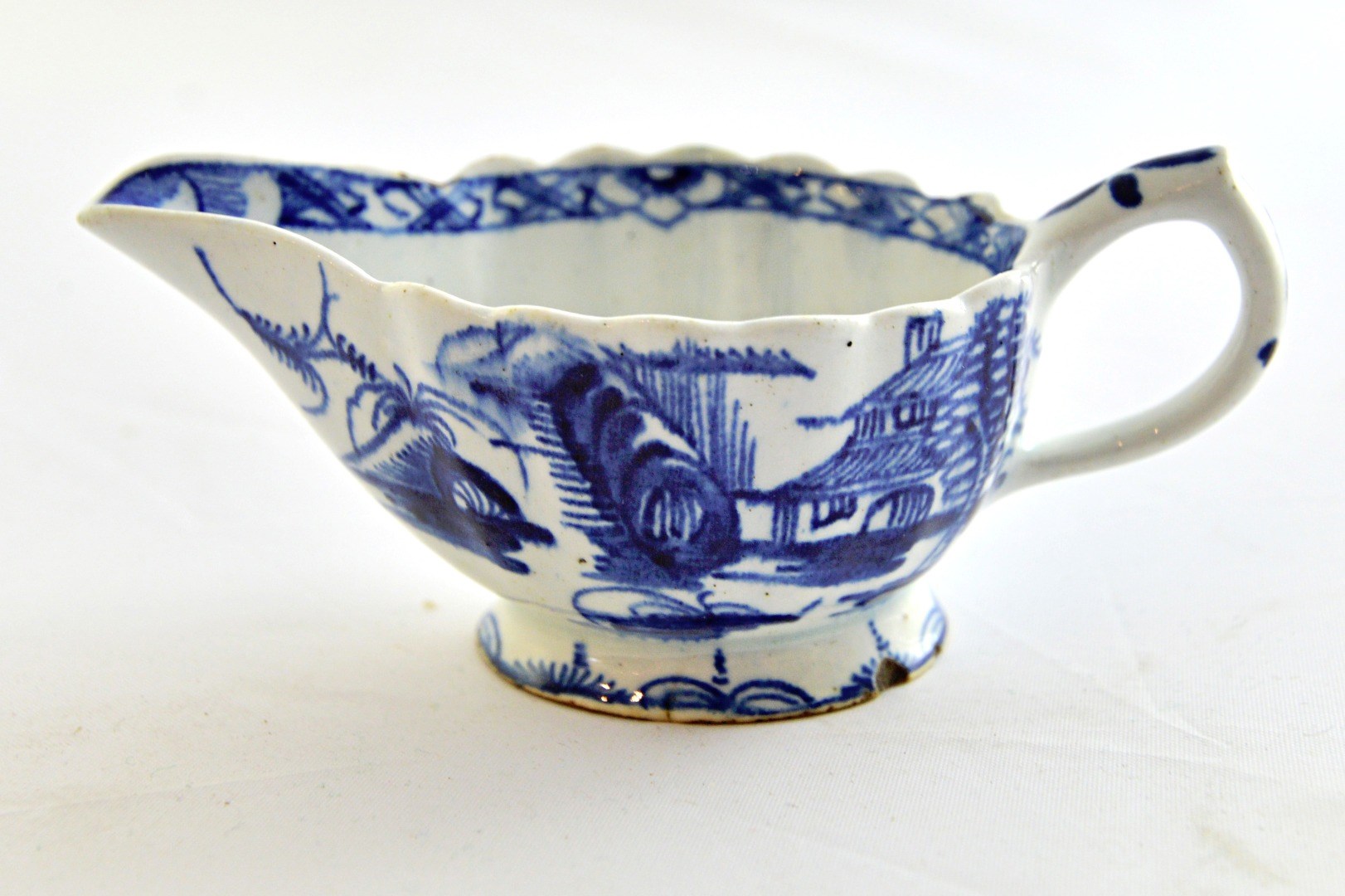 Appraisal: A small Bow blue and white oval fluted creamboat circa