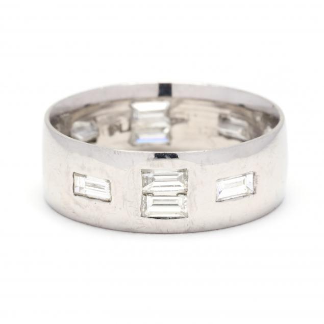 Appraisal: PLATINUM AND DIAMOND BAND The wide rounded band set with