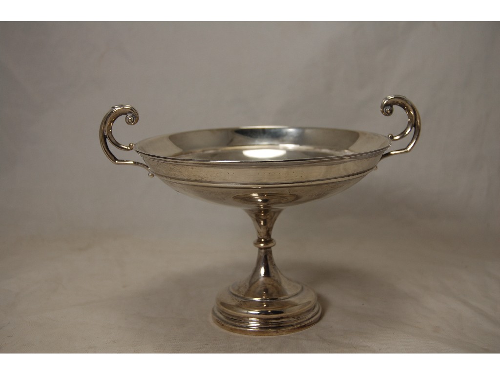 Appraisal: Circular silver tazza on foot with flying scroll handles Sheffield