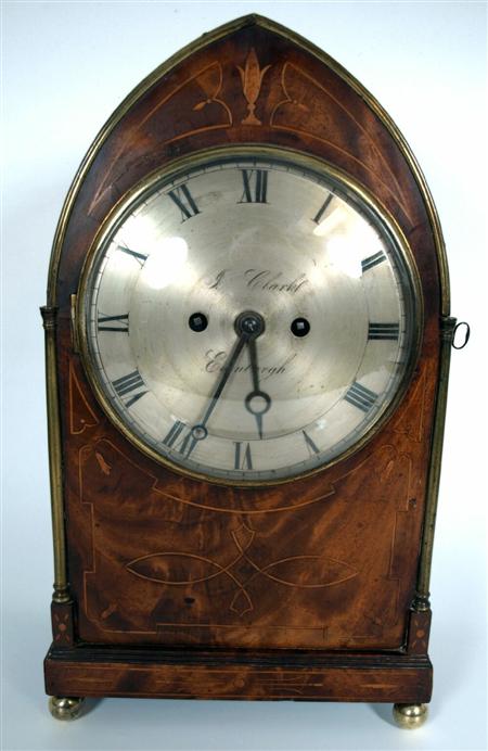 Appraisal: A Regency mahogany and brass Gothic style mantel clock By