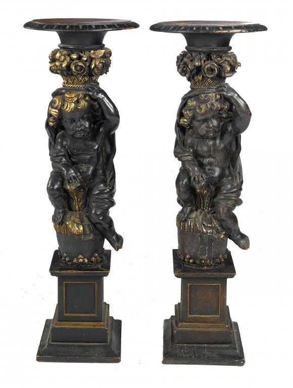 Appraisal: A PAIR OF ITALIAN CARVED EBONISED AND GILTWOOD TORCH RES