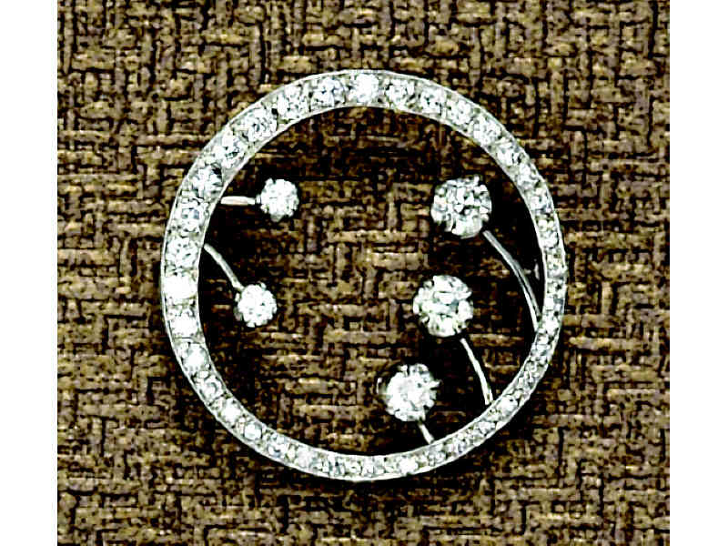 Appraisal: DIAMOND CIRCLE PIN White gold circle design set with three