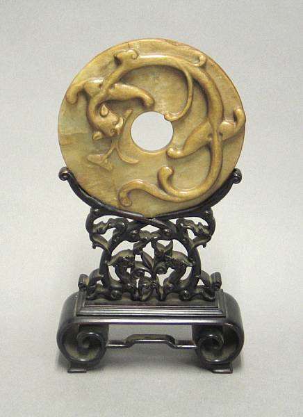 Appraisal: An amber nephrite bi disc Republican Period With raised chilong