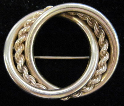 Appraisal: Yellow gold interlocking circle pin th century