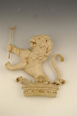 Appraisal: A carved limewood rampant lion crest issuing from a marquess's