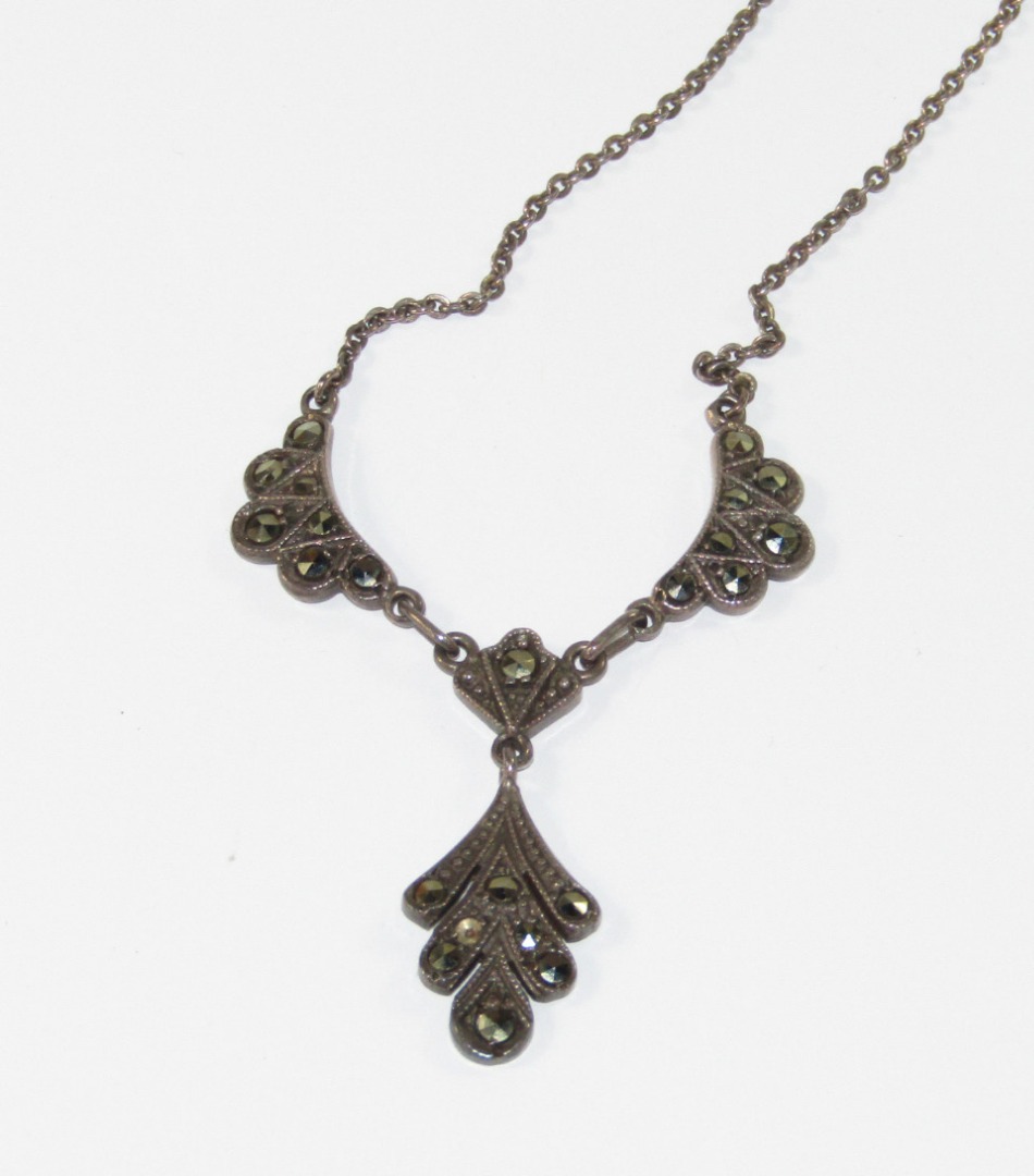 Appraisal: An Edwardian silver and marcasite drop pendant necklace in period