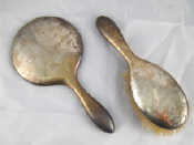 Appraisal: A sterling silver backed hand mirror and brush Birmingham some