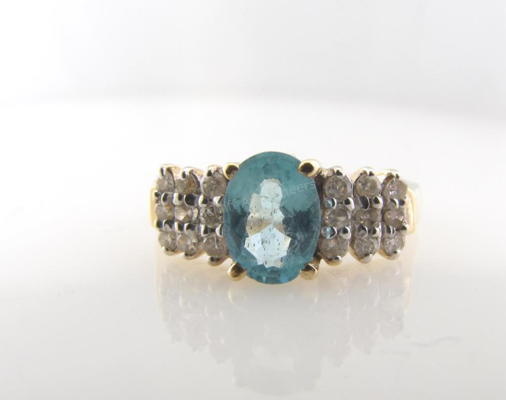 Appraisal: A K yellow gold ring with an oval blue zircon